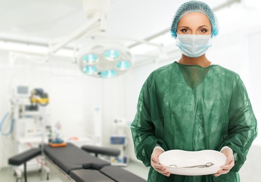 Young Woman Doctor Holding Medicine Tray 