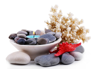 Fototapeta na wymiar Composition with spa stones, candle, coral and star fish,