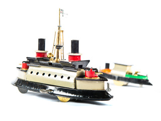 Tin toy boats over isolated white background