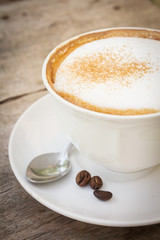 Obraz na płótnie Canvas Coffee cup with beans