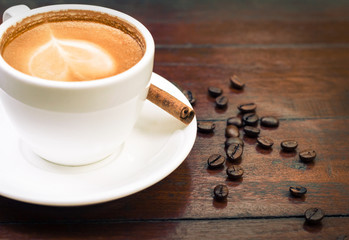 Coffee cup with cinnamon stick