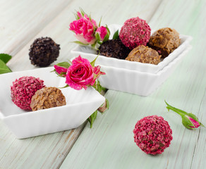 Chocolates on wooden table.