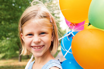 smiling girl with balloons