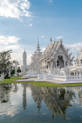 white temple  Wat Rong Khun and reflection.  Chiang Rai province