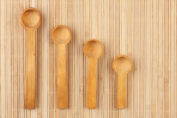 Wooden spoon  on a bamboo mat