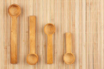 Wooden spoon  on a bamboo mat