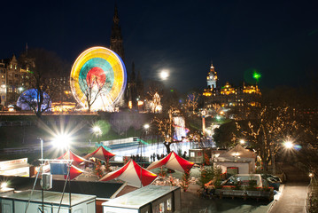 Vertical colour image of Edinburgh at night during Christmas
