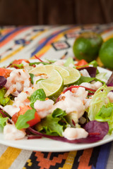 salad with prawns lime tomato lettuce arugula