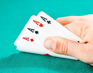 playing cards in a man hand