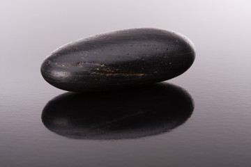 Spa stone arrangement on black surface