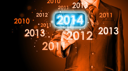 Businessman touching new year 2014
