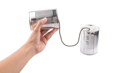 Female hand holding a tin can telephone
