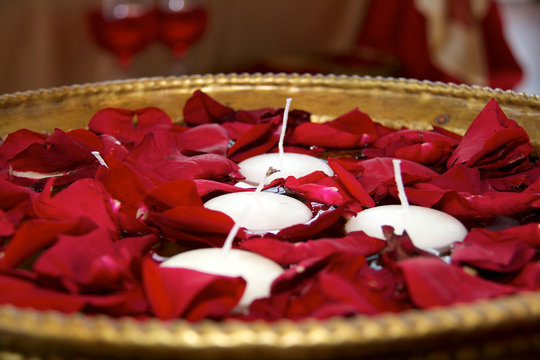 Bowl of petals and candles at the wedding