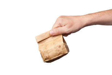 Paper bag in hand, isolated on white background