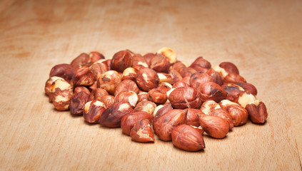 Hazelnuts on wooden background