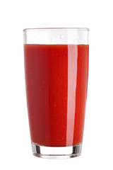 Tomato juice in a glass isolated on white background