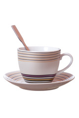 teacup and saucer with a spoon on a white background