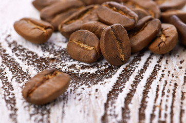 Coffee beans on wood background