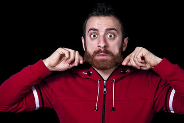 Obraz premium young guy pulls his long red beard