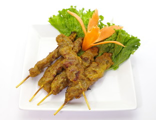 Grilled Pork Satay with fresh vegetable on white background