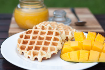Breakfast waffles with mango