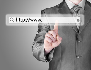 Businessman pushing virtual search bar