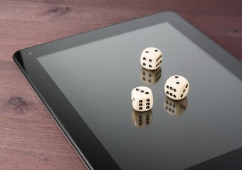 dice on digital tablet pc, concept of texas game online
