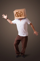 Young man gesturing with a cardboard box on his head with spur w