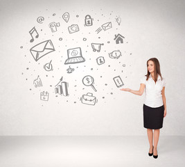 Young business woman presenting hand drawn media icons
