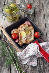 Portion of fresh fried meat in the red pan.Selective focus.