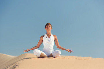 Yoga meditation on the beach, healthy female body in peace