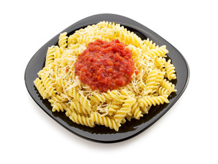 pasta fusilli in plate on white