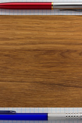 checked note paper on wood