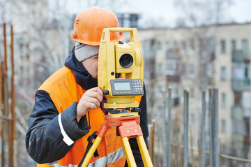 surveyor works with theodolite