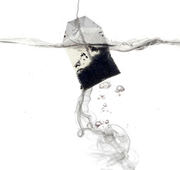 Tea bag dipped in hot water