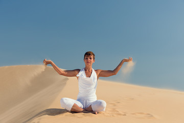 Fototapeta na wymiar Yoga meditation on the beach, healthy female body in peace