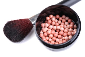 Powder balls and brush isolated on white
