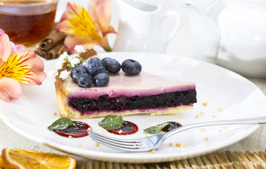 piece of blueberry pie on a table in a restaurant