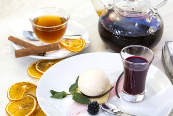 dessert, a piece of cake on the table with a cup of tea