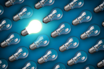 Idea concept with light bulbs on blue background