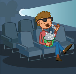 Boy eating popcorn watching movie in cinem