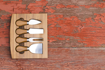 Set of cheese cutters in a fitted wooden block