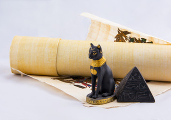 Egyptian cat, a pyramid and papyrus - souvenirs from travels