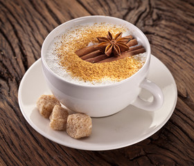 Cup of cappuccino decorated with spices.