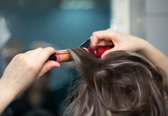 wrap curling hair in a beauty salon