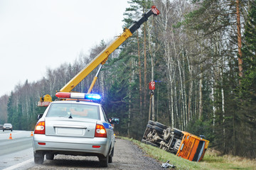 police car with a flasher at lorry crash