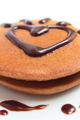 Chocolate pancakes with chocolate sauce.