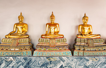Three Buddha statue in Wat Po Temple, Thailand