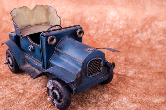 Vintage toy cars in an old background