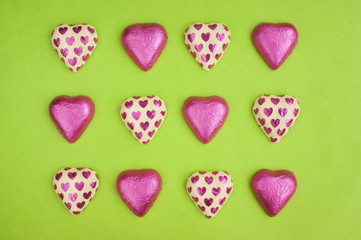 Collection of chocolate heart shapes wrapped in tin foil.
